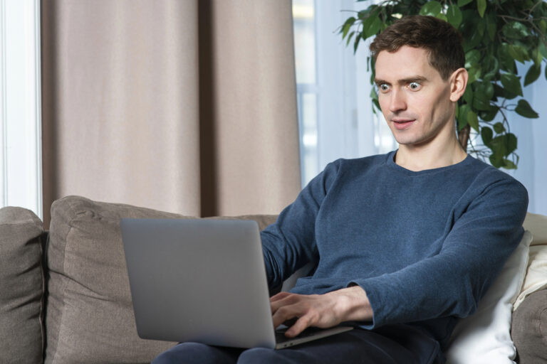 Crazy man typing on a computer